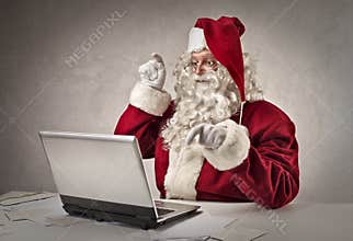 Santa Claus typing on the keyboard