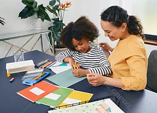African American girl with autistic disorder with child's psychologist while psychological treatments for kid