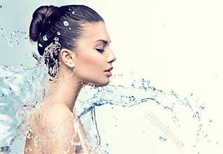 Beautiful model woman with splashes of water