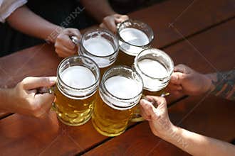 People drinking beer in a traditional Bavarian beer garden