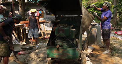 Bhadrak, Odisha, India - Dec 27 , 2024 : Construction Workers Working on Site