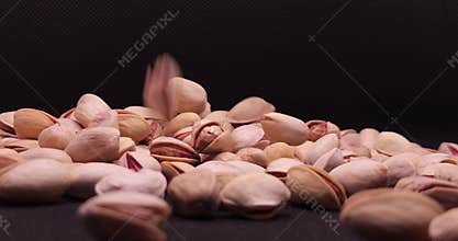 Roasted Salted Pistachios Falling Close Up