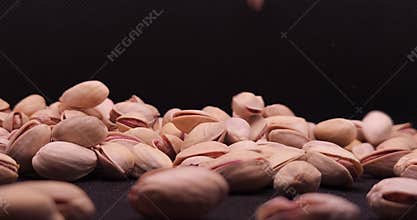 Roasted Salted Pistachios Falling Close Up