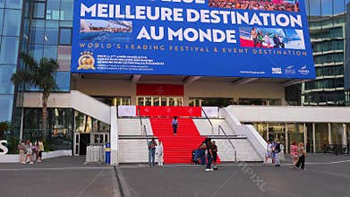 Palais des Festivals in Cannes with red carpet steps and billboard