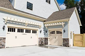 Residential house three car garage doors