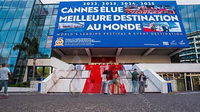 Palais des Festivals entrance with billboard and red carpet, Cannes