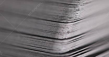 cardboard semicircular corners folded together, recycled material