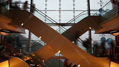 Timelapse video of people on escalators in a shopping mall
