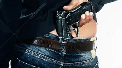 Man holding gun in pants