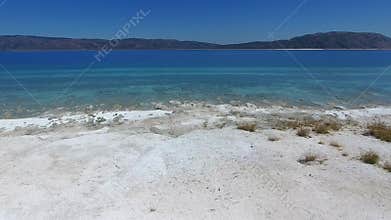 Aerial view of white sand and turquoise water along Salda Lake in Turkiye, beach, summer, landscape, freshwater