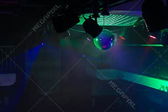 Empty Night Club Lit with Green Spotlights