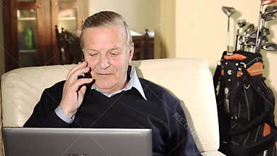 Senior businessman working at home