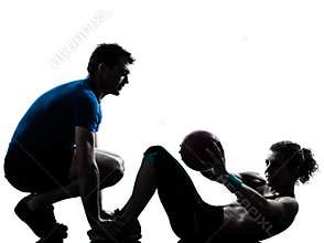 Man woman exercising weights workout fitness ball silhouette