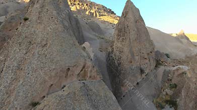 Aerial drone view of Cappadocia fairy chimneys and sculpted volcanic valleys in Turkiye, rock formations, badlands, volcanic tuff