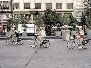 People going about their daily lives in the streets of the city of Valencia