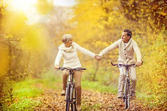 Active seniors riding bike