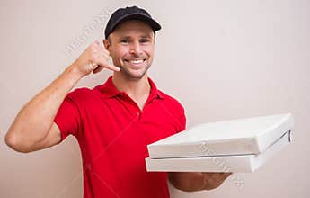 Pizza delivery man making phone call gesture