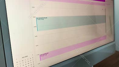 Business calendar displaying color-coded weekly tasks. Screen recording of