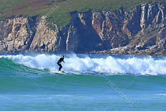 Surfer surfing in the Atlantic waves , ocean, sea sports and adventure , near Ferrol, Galicia, Spain