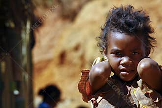 Poverty, portrait of a poor little African girl