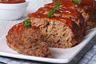 Sliced meatloaf with ketchup and parsley horizontal