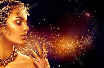 Gold woman skin. Beauty fashion model girl with golden makeup