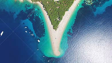 Aerial view of people sunbathing on a sandy beach on the island of Brac, Croatia