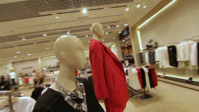 Fast Motion across Store and Focus on Mannequin in Red Jacket