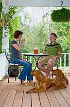 Couple with dogs on Porch