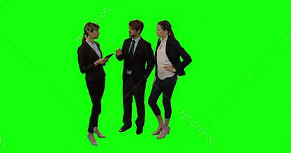 Businesspeople discussing over digital tablet