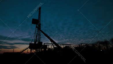 Timelapse Drilling Rig Oil Industry during Sunset