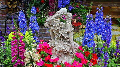 Romantic pose figurines surrounded by exotic flowers
