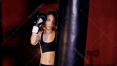 Beautiful confident athletic woman boxing. Woman strength concept.