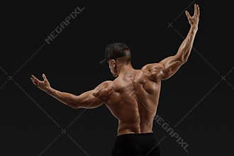Athlete turning back and rise both hands