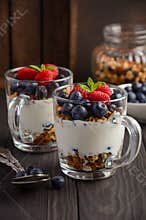 Yogurt parfait with granola and fresh berries, healthy breakfast concept