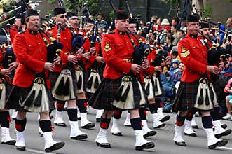 Kilted Bagpipe players marching
