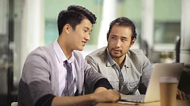 Asian business people celebrating success and achievement