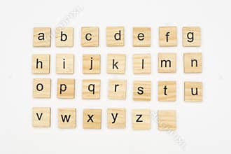 Lowercase alphabet letters on scrabble wooden blocks