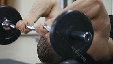 Male bodybuilder training hands. Preparing for the competition. Healthy lifestyle