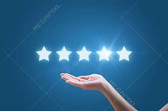 Businesswoman hand holding five stars isolated