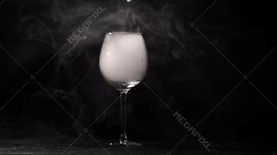 Vaping at bar in beautiful glass for wine indoors