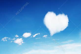 lonely white heart shaped cloud on blue sky for pattern