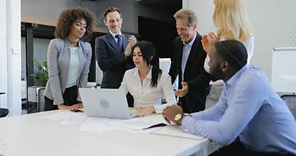 Business people group clapping hands congradulate businesswoman presenting new project on laptop computer, team happy of