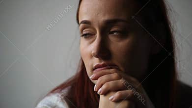 Portrait of a depressed woman thinking about her thoughts