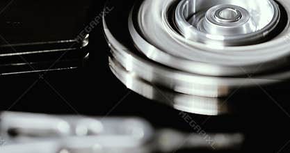 Computer hard drive. Technology, computer systems. Cloud storage. Binary code. The head reads data from the disk