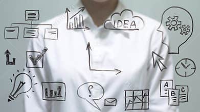 Woman drawing decrease diagram with red down arrow on transparent screen.