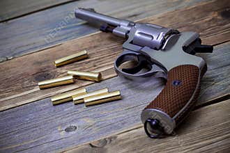 Silvery Nagan revolver with cartridges