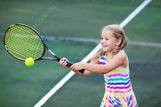 Child playing tennis on outdoor court