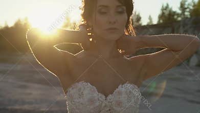 Bride posing at sunset