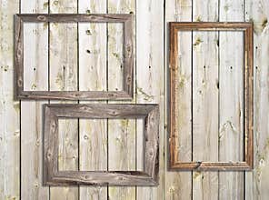 Old wooden frames on wooden background